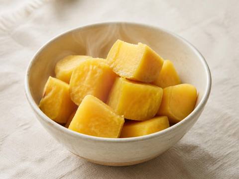 A bowl of soft, plainly cooked sweet potato cubes with no butter, salt or seasoning